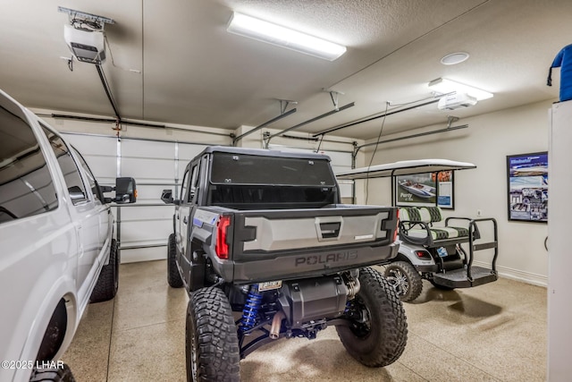 garage with a garage door opener and baseboards