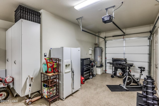 garage featuring water heater, a garage door opener, and white fridge with ice dispenser