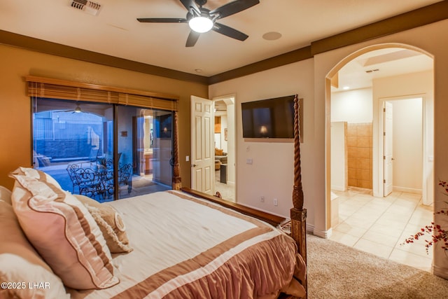 tiled bedroom featuring access to exterior, visible vents, baseboards, carpet, and arched walkways