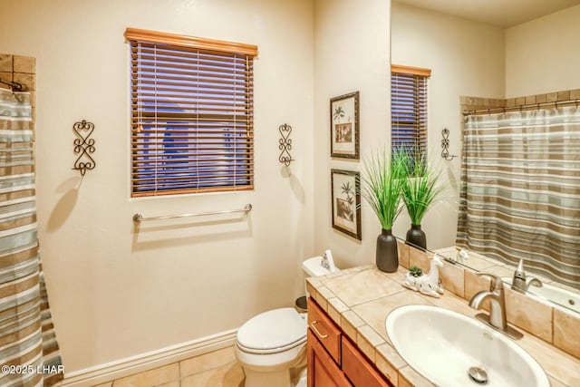 full bathroom with tile patterned flooring, baseboards, toilet, a shower with curtain, and vanity