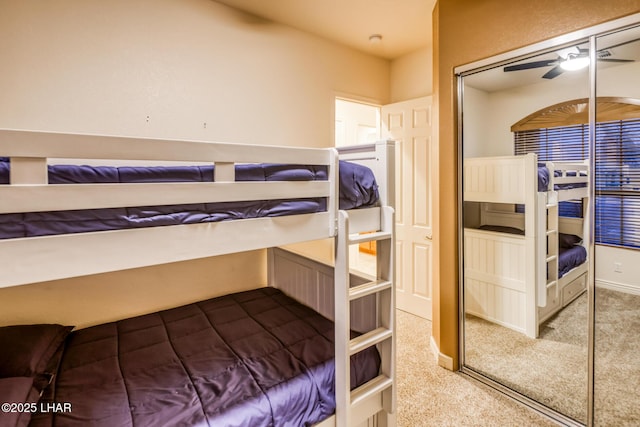 bedroom featuring baseboards, a closet, and carpet floors