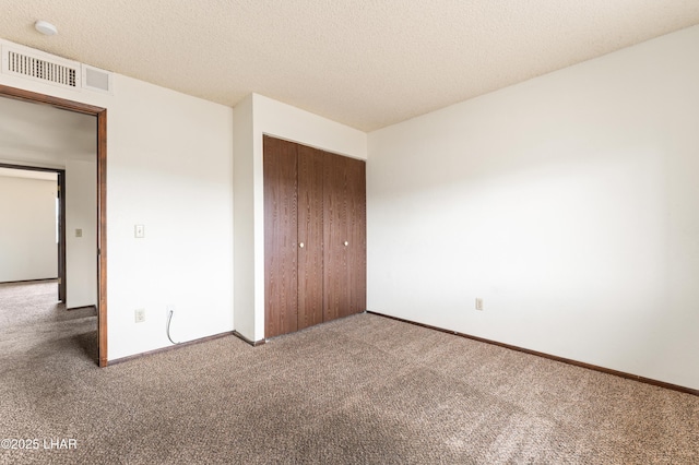 2780 Cisco Dr N, Lake Havasu City, AZ 86403 - unfurnished bedroom featuring visible vents, a closet, carpet floors, and a textured ceiling