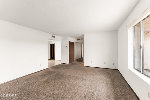 2780 Cisco Dr N, Lake Havasu City, AZ 86403 - spare room with baseboards, carpet, and visible vents