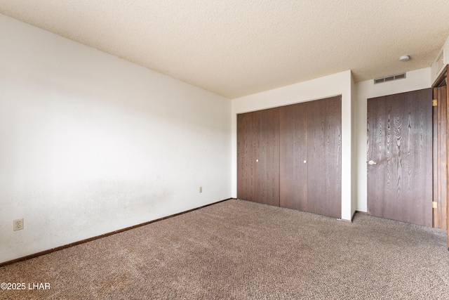 2780 Cisco Dr N, Lake Havasu City, AZ 86403 - unfurnished bedroom featuring a textured ceiling, a closet, visible vents, and carpet floors