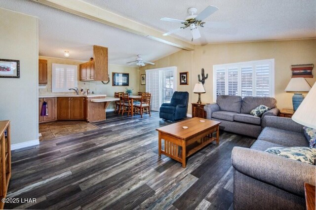 10056 Harbor View Rd, Parker, AZ 85344 - living room featuring ceiling fan, dark wood-style flooring, and baseboards