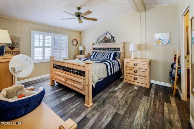 10056 Harbor View Rd, Parker, AZ 85344 - bedroom with dark wood-type flooring, baseboards, a textured ceiling, a ceiling fan, and beamed ceiling