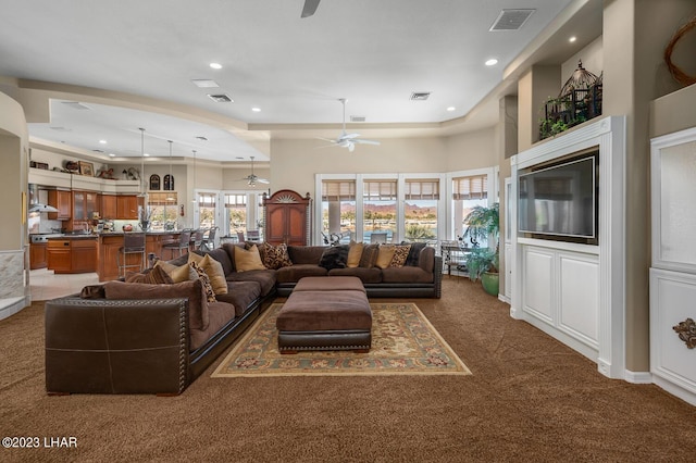 8480 Miraleste Shores Dr, Parker, AZ 85344 - living room featuring a ceiling fan, carpet, recessed lighting, and a towering ceiling