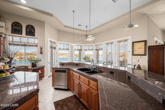 8480 Miraleste Shores Dr, Parker, AZ 85344 - kitchen with tile counters, stainless steel dishwasher, pendant lighting, healthy amount of natural light, and recessed lighting