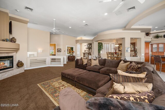 8480 Miraleste Shores Dr, Parker, AZ 85344 - living room featuring a ceiling fan, carpet floors, a glass covered fireplace, and recessed lighting