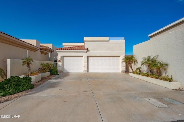 8480 Miraleste Shores Dr, Parker, AZ 85344 - view of front facade featuring stucco siding, a garage, driveway, and a tile roof