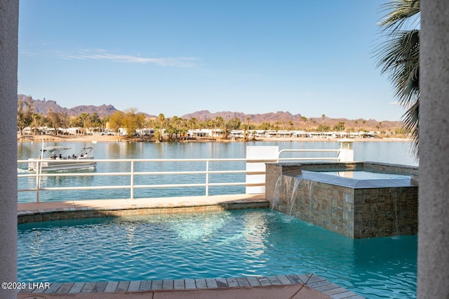 8480 Miraleste Shores Dr, Parker, AZ 85344 - view of swimming pool featuring a water and mountain view and a pool with connected hot tub