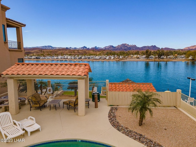 8480 Miraleste Shores Dr, Parker, AZ 85344 - view of swimming pool featuring a water and mountain view and a patio