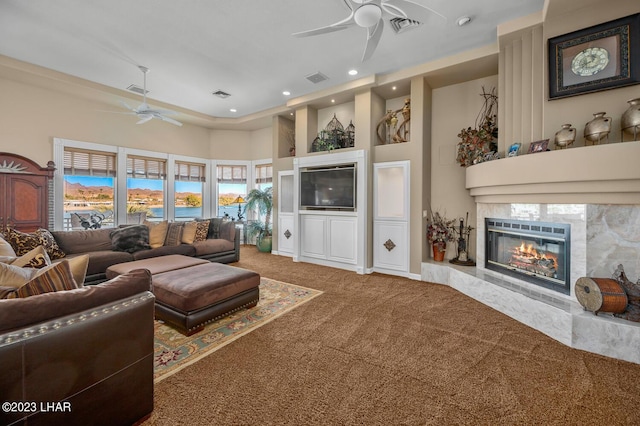 8480 Miraleste Shores Dr, Parker, AZ 85344 - living area featuring ceiling fan, carpet, a fireplace, recessed lighting, and a towering ceiling