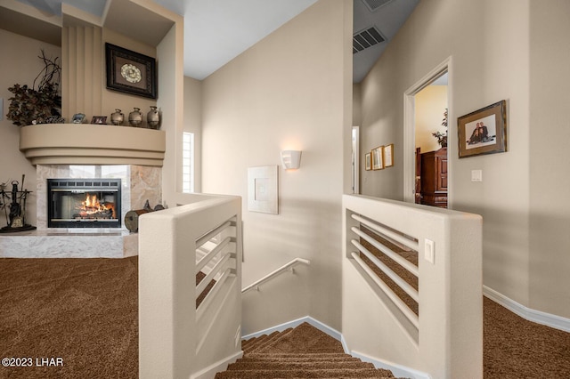 8480 Miraleste Shores Dr, Parker, AZ 85344 - staircase featuring carpet flooring and a fireplace