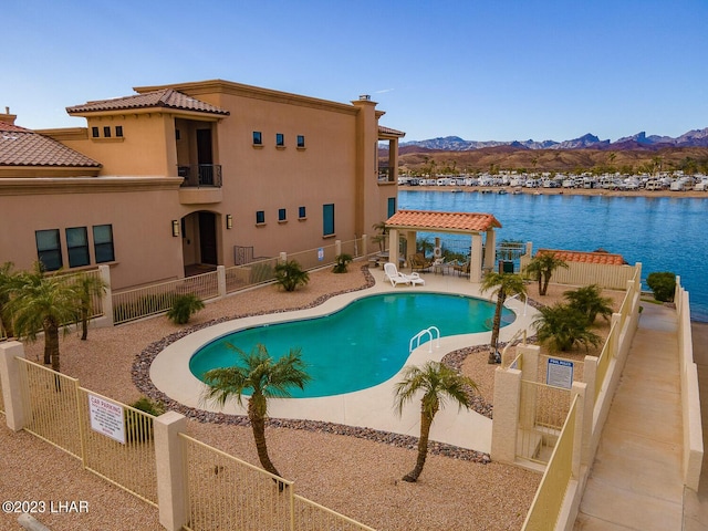 8480 Miraleste Shores Dr, Parker, AZ 85344 - community pool featuring a fenced backyard, a gazebo, a patio area, and a water and mountain view