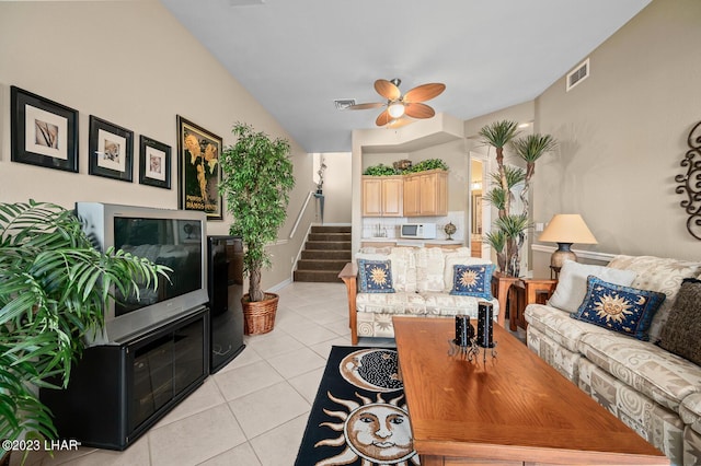 8480 Miraleste Shores Dr, Parker, AZ 85344 - living room featuring stairway, light tile patterned floors, and ceiling fan