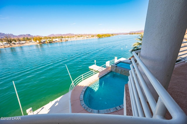 8480 Miraleste Shores Dr, Parker, AZ 85344 - view of pool featuring a water and mountain view, a boat dock, and a pool with connected hot tub