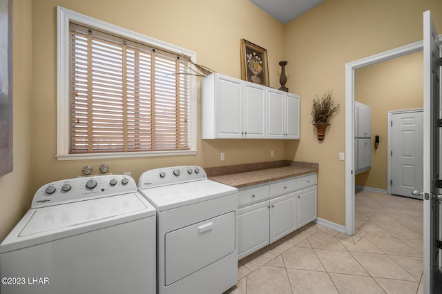 8480 Miraleste Shores Dr, Parker, AZ 85344 - laundry area featuring cabinet space, independent washer and dryer, and light tile patterned floors