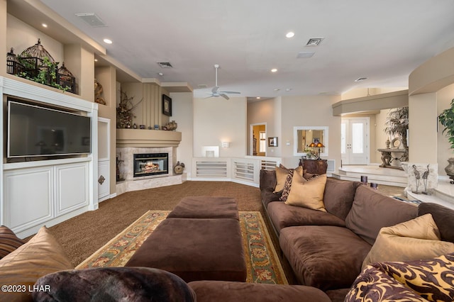 8480 Miraleste Shores Dr, Parker, AZ 85344 - living room with ceiling fan, dark colored carpet, a fireplace, and recessed lighting