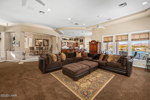 8480 Miraleste Shores Dr, Parker, AZ 85344 - carpeted living area featuring ceiling fan, recessed lighting, and arched walkways