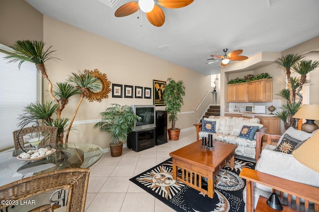 8480 Miraleste Shores Dr, Parker, AZ 85344 - living room with a ceiling fan, light tile patterned floors, and stairs