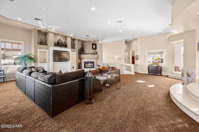 8480 Miraleste Shores Dr, Parker, AZ 85344 - living area featuring a ceiling fan, carpet, recessed lighting, and a glass covered fireplace