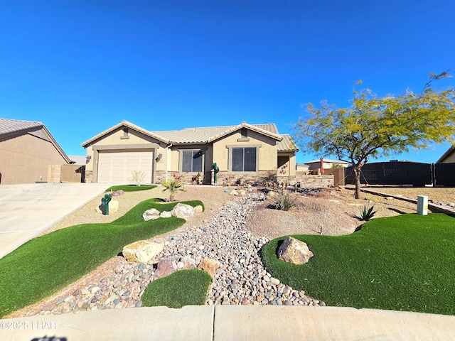 view of front of property with a garage and a front yard