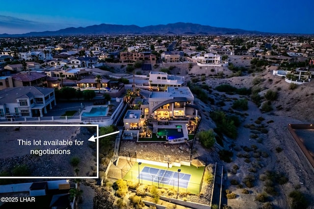 birds eye view of property featuring a mountain view