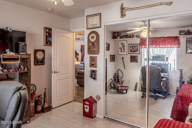 home office featuring light wood-style floors and ceiling fan