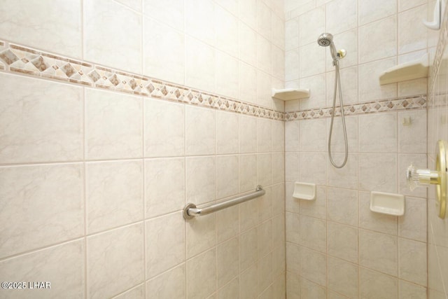 bathroom with a tile shower