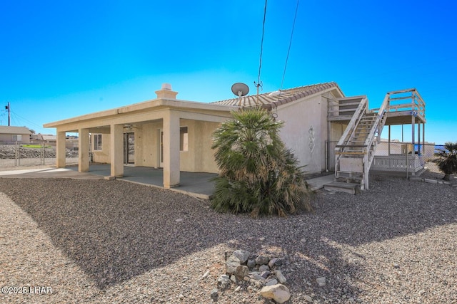 back of property featuring a patio area