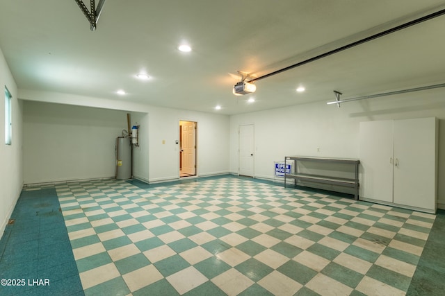 garage featuring gas water heater, baseboards, a garage door opener, and recessed lighting