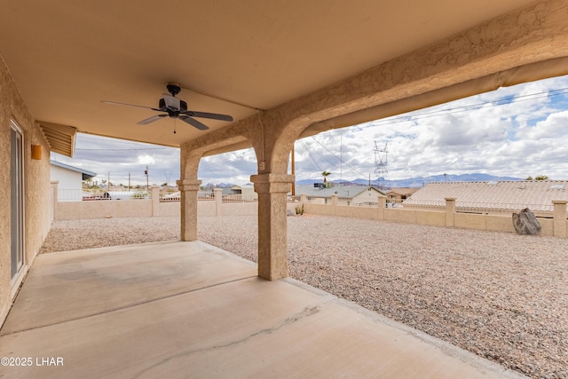 view of patio with a ceiling fan and a fenced backyard