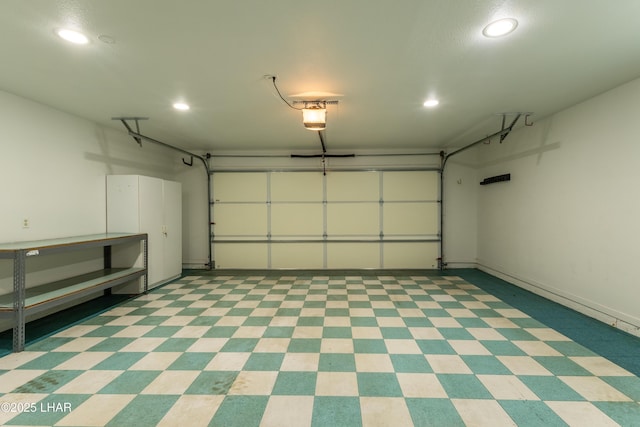 garage featuring recessed lighting and a garage door opener