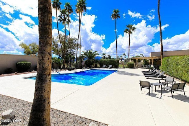 pool with a patio