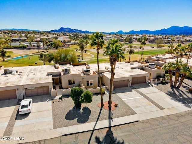 birds eye view of property featuring a mountain view