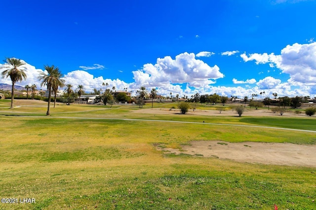 view of property's community featuring a yard