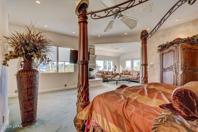 bedroom featuring decorative columns and light colored carpet