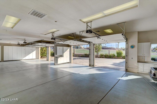 garage featuring a garage door opener