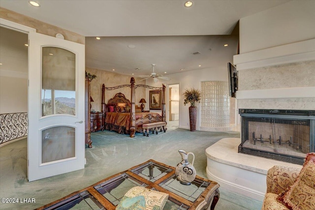 carpeted bedroom with a multi sided fireplace