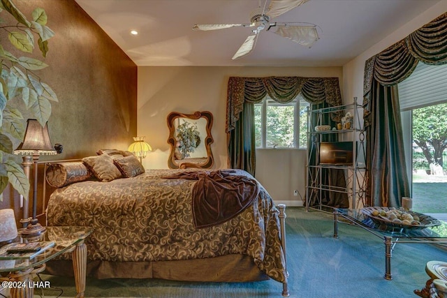 bedroom with ceiling fan and carpet flooring