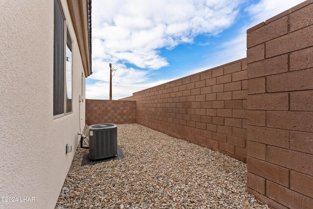 view of yard with central AC