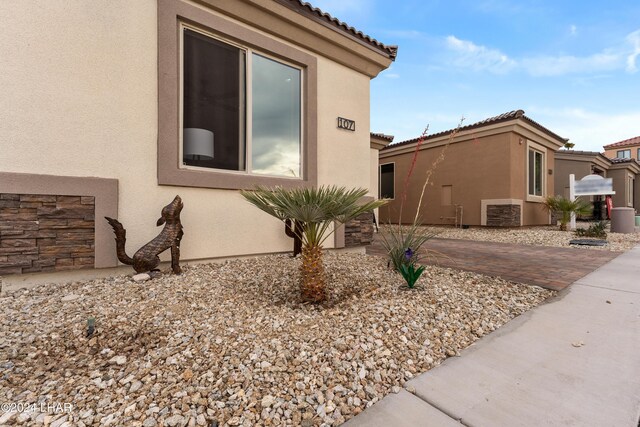 view of side of home featuring a patio