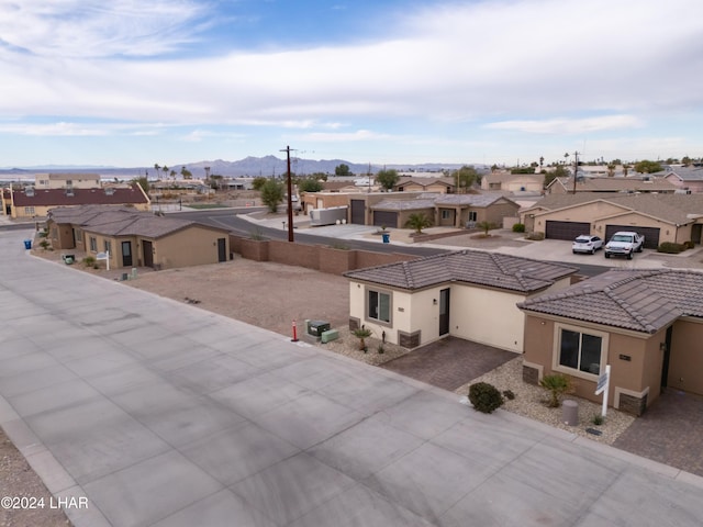 birds eye view of property featuring a mountain view