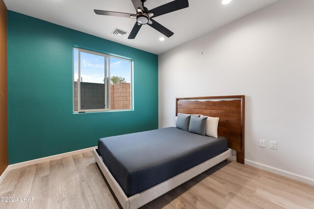 bedroom featuring ceiling fan and light wood-type flooring