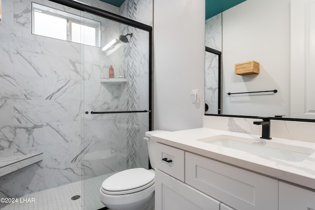 bathroom with vanity, an enclosed shower, and toilet