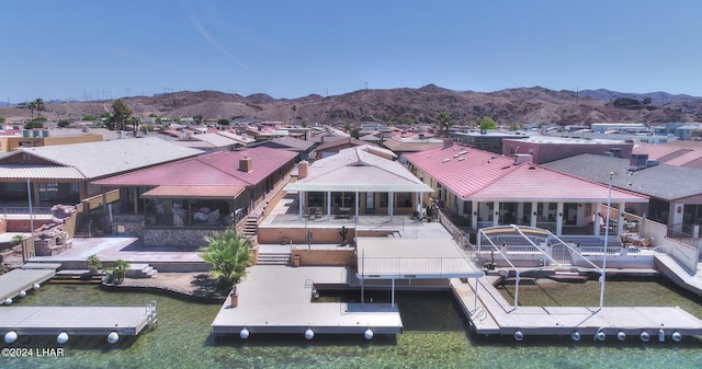 rear view of property featuring a mountain view