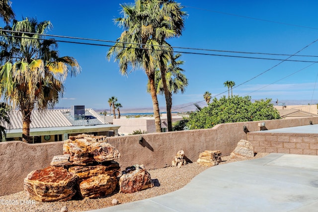 view of yard featuring a patio area, fence private yard, and central air condition unit