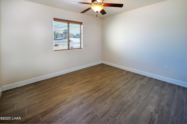 unfurnished room featuring ceiling fan, baseboards, and dark wood-type flooring