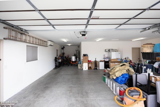 garage with a garage door opener and freestanding refrigerator